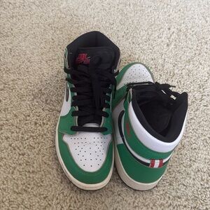Air jordan 1 mid women, size: 8.5, color: green, black, and red detailing.